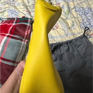 Yellow Balenciaga cross body bag